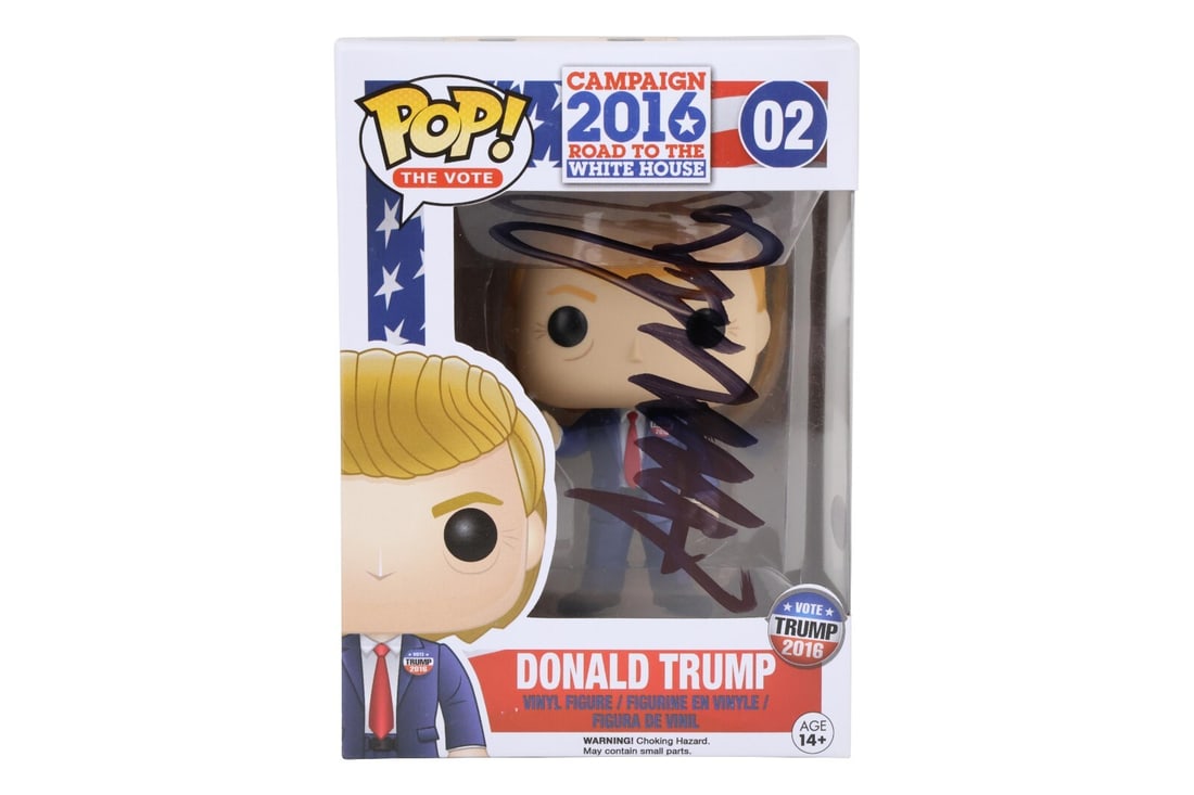 Rare Donald Trump Signed Funko Pop with PSA DNA COA: Rare Donald Trump Signed Funko Pop with PSA DNA COA This unique collectible features a Funko Pop figure of President Donald Trump, signed in bold black marker. The signature has been authenticated by 