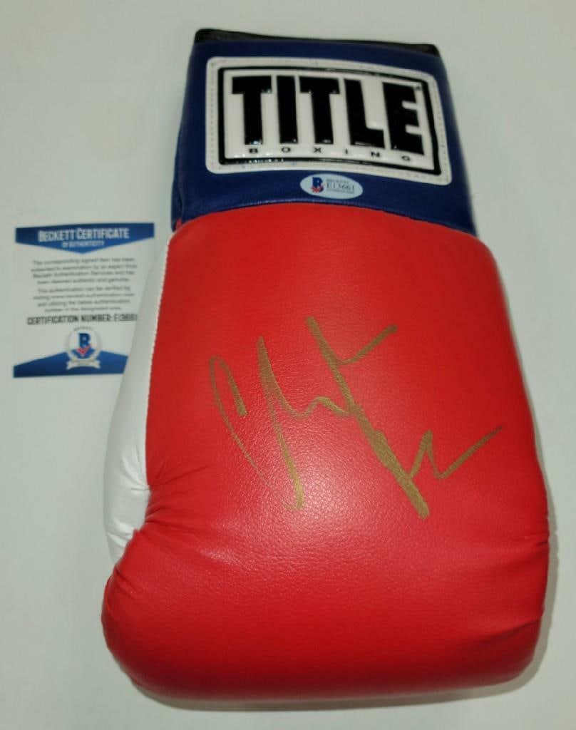 Christian Bale Signed Boxing Glove from The Fighter Beckett Authenticated: Christian Bale Signed Boxing Glove from The Fighter Beckett Authenticated This boxing glove features the autograph of Christian Bale, known for his role in 'The Fighter.' The signature is authenticate
