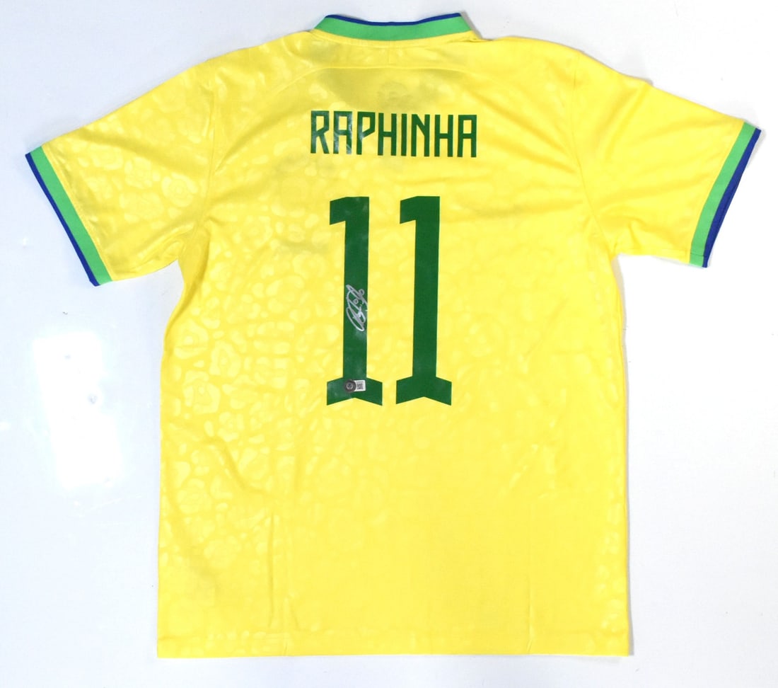 Brazil Home Jersey Signed by Raphinha with Beckett Hologram: Brazil Home Jersey Signed by Raphinha with Beckett Hologram This is a pre-owned Brazil home soccer jersey autographed by Raphinha and featuring his number 11. The jersey is an original item and includ