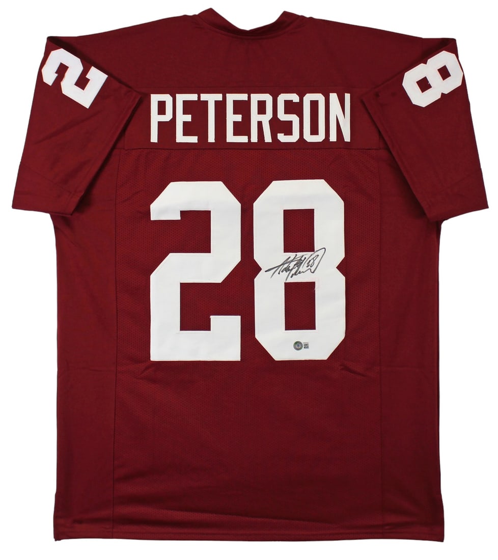 Adrian Peterson Signed Oklahoma Sooners Maroon Jersey BAS Witnessed: Adrian Peterson Signed Oklahoma Sooners Maroon Jersey BAS Witnessed This authentic maroon pro style jersey is a remarkable piece for any football fan, personally signed by Adrian Peterson, the legenda