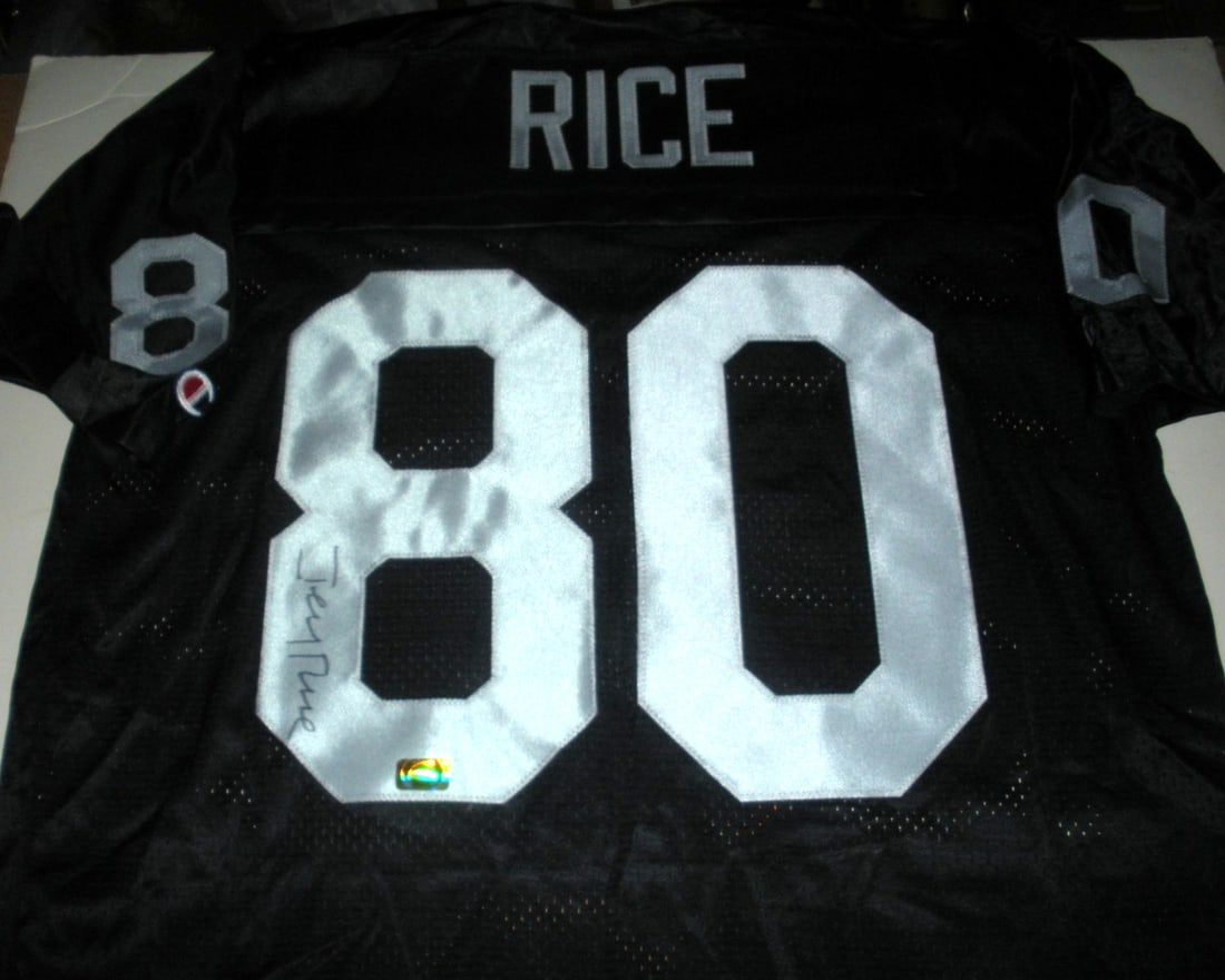 Signed Champion Jerry Rice Oakland Raiders football jersey with COA: Signed Champion Jerry Rice Oakland Raiders football jersey with COA This is an official licensed Oakland Raiders Champion jersey signed by Jerry Rice. The jersey comes with a certificate of authentici