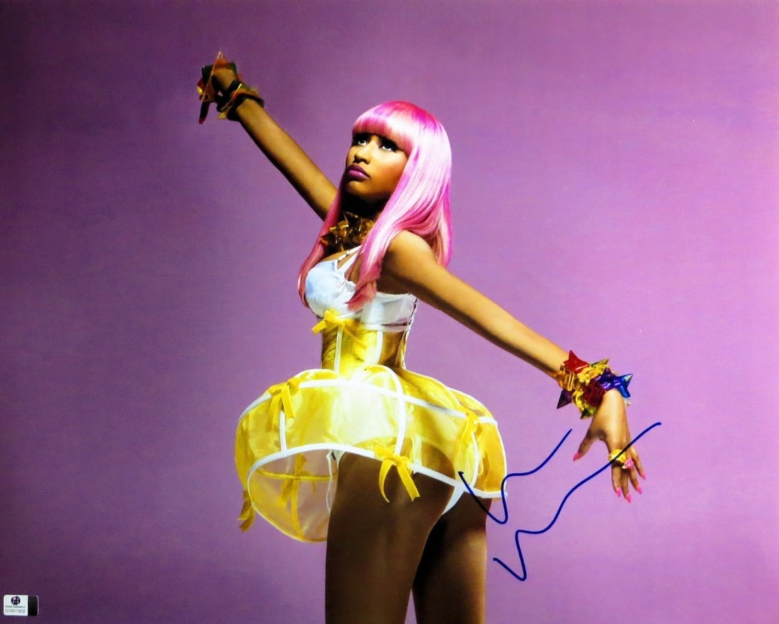 Nicki Minaj 16x20 Authenticated Signed Photograph in Yellow Dress by GAI: Nicki Minaj 16x20 Authenticated Signed Photograph in Yellow Dress by GAI This is an original 16x20 photograph autographed by Nicki Minaj, featuring her in a yellow dress. The signature has been authen