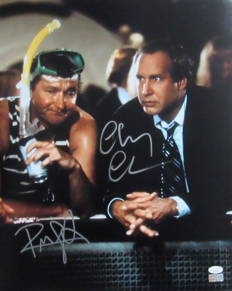 Chevy Chase Randy Quaid Dual-Signed 16x20 Vegas Vacation Photo JSA Certified: Chevy Chase Randy Quaid Dual-Signed 16x20 Vegas Vacation Photo JSA Certified This is an original 16x20 photograph featuring dual signatures from Chevy Chase and Randy Quaid, commemorating their roles 