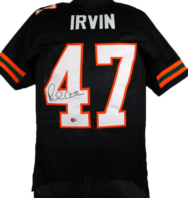Signed Miami Hurricanes football jersey Michael Irvin Beckett hologram: Signed Miami Hurricanes football jersey Michael Irvin Beckett hologram Pre-owned black college style jersey autographed by Michael Irvin. The jersey includes a Beckett W hologram and was made in the U