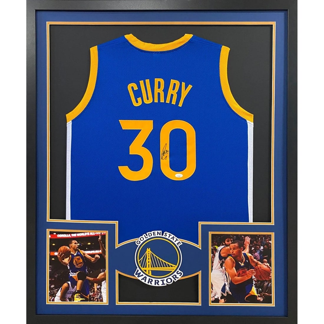 Framed Steph Curry Autographed Warriors Jersey JSA Authenticated: Framed Steph Curry Autographed Warriors Jersey JSA Authenticated This framed Steph Curry jersey features an authentic autograph and is professionally presented with attention to detail, including the 