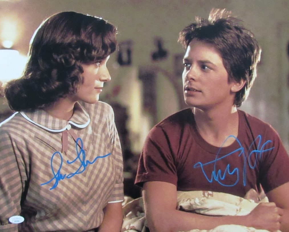 Michael J Fox Lea Thompson Dual-Signed 16x20 Back to the Future Photo JSA Authenticated: Michael J Fox Lea Thompson Dual-Signed 16x20 Back to the Future Photo JSA Authenticated Celebrate the iconic film "Back to the Future" with this exceptional dual-autographed 16x20 photo featuring Mich