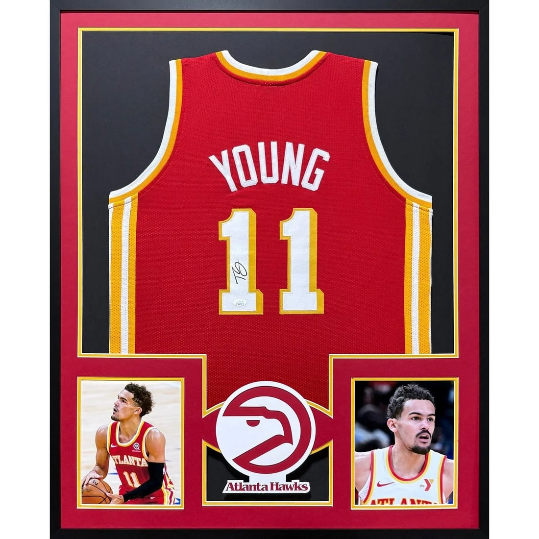 Framed Trae Young Atlanta Hawks JSA Autographed Jersey 42x34: Framed Trae Young Atlanta Hawks JSA Autographed Jersey 42x34 This framed Atlanta Hawks jersey is autographed by Trae Young and authenticated by JSA, featuring a tamper-proof sticker for added assuranc