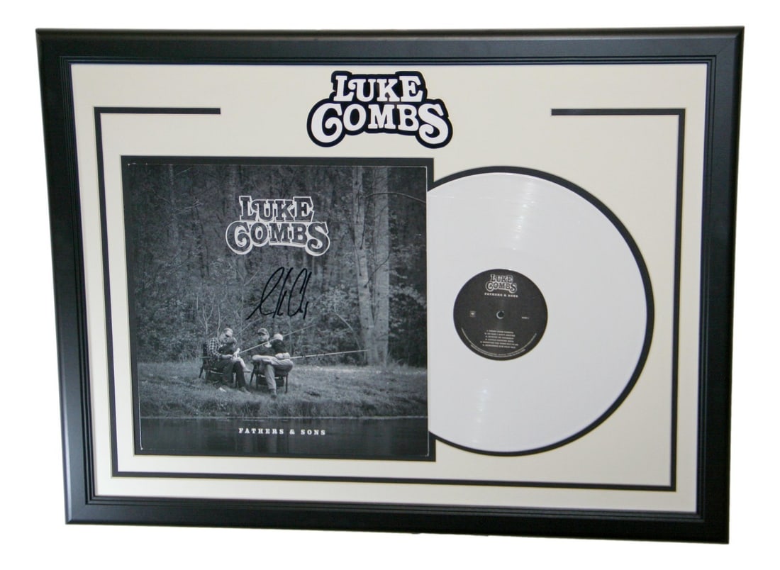 Framed Luke Combs Signed Album Cover PSA DNA Original: Framed Luke Combs Signed Album Cover PSA DNA Original Autographed framed album cover signed by Luke Combs. This original piece is authenticated by PSA/DNA and is listed in pre-owned condition. Specifi