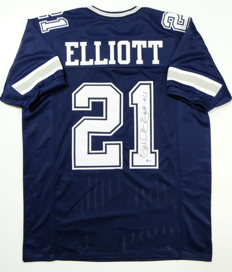 Beckett Authenticated Ezekiel Elliott Signed Blue Football Jersey: Beckett Authenticated Ezekiel Elliott Signed Blue Football Jersey Autographed Ezekiel Elliott blue pro style football jersey. The item is described as original and pre-owned, with Beckett W authentica