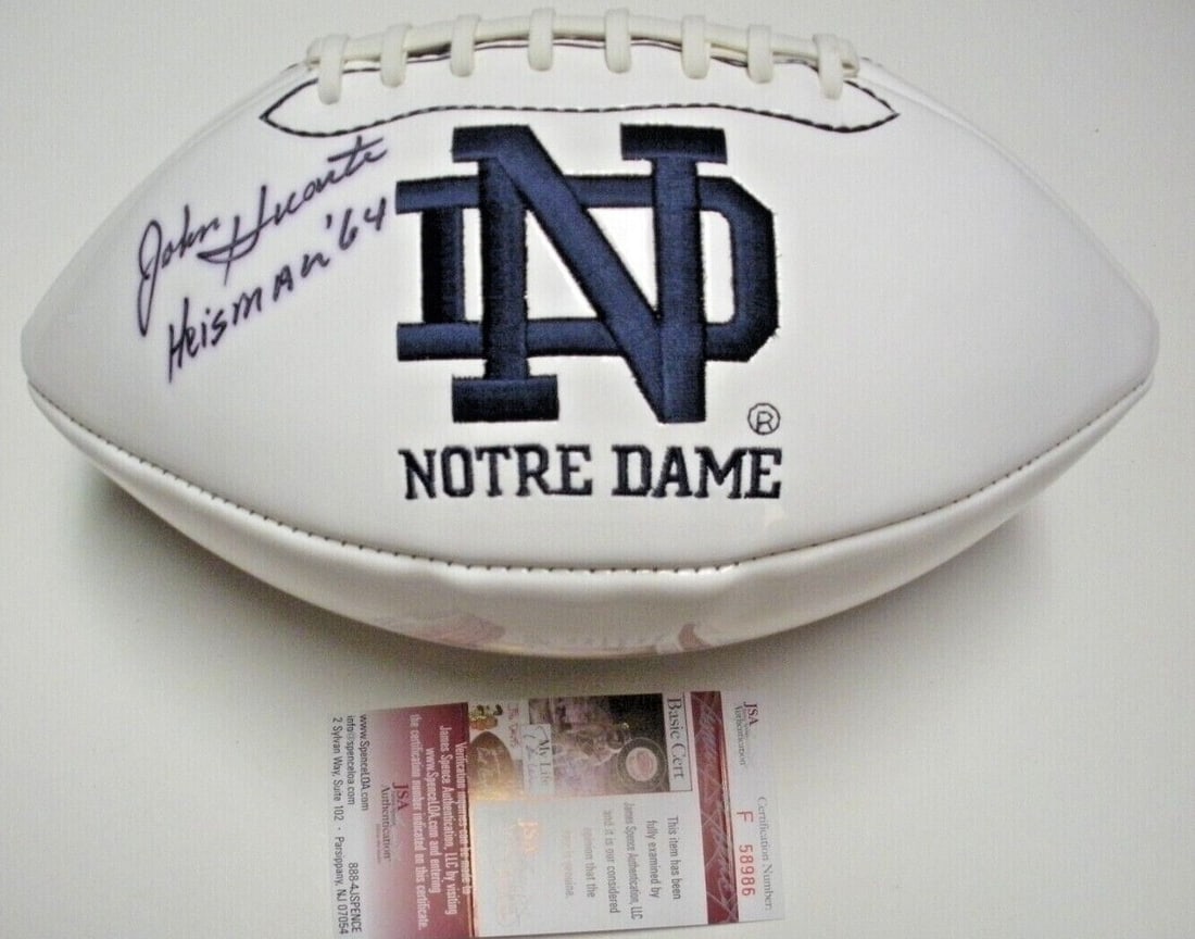 John Huarte Signed Notre Dame Football with JSA COA Heisman 1964: John Huarte Signed Notre Dame Football with JSA COA Heisman 1964 This is a pre-owned football signed by John Huarte, notable for his time with the Notre Dame Fighting Irish and as the 1964 Heisman Tro