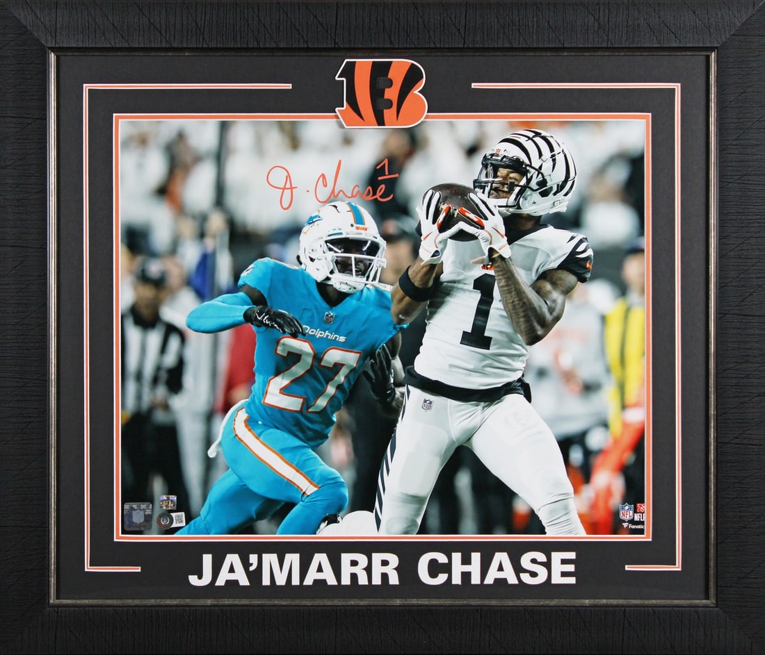 Ja'Marr Chase Signed 16x20 Framed Photo vs. Dolphins BAS Authenticated: Ja'Marr Chase Signed 16x20 Framed Photo vs. Dolphins BAS Authenticated Celebrate the talent of Ja'Marr Chase with this stunning autographed 16x20 framed photo showcasing his electrifying performance a