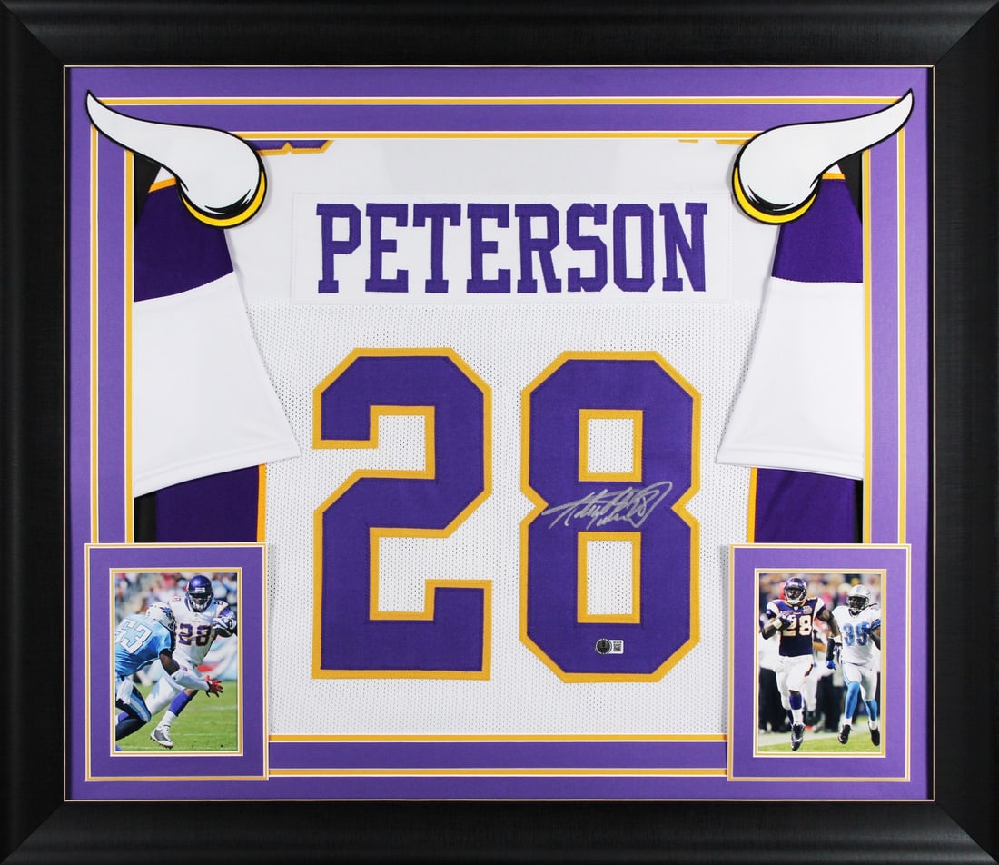 Framed Adrian Peterson Signed White Pro Style Jersey Beckett Witnessed: Framed Adrian Peterson Signed White Pro Style Jersey Beckett Witnessed This autographed white pro style framed jersey has been personally signed by Adrian Peterson of the Minnesota Vikings. It is an o