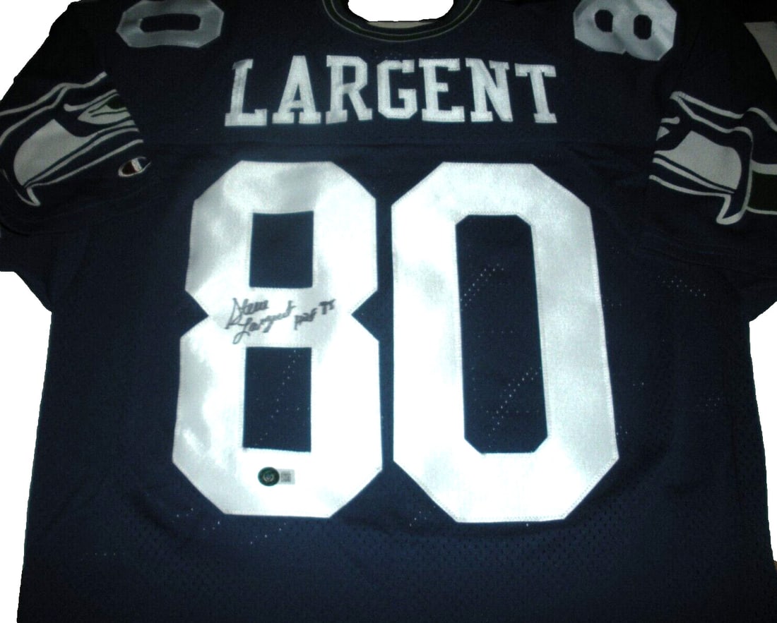 Champion Seattle Hawks Jersey Signed by Steve Largent with Beckett COA: Champion Seattle Hawks Jersey Signed by Steve Largent with Beckett COA This is a pre-owned official licensed Champion jersey signed by Steve Largent of the Seattle Seahawks. The jersey comes with a Be
