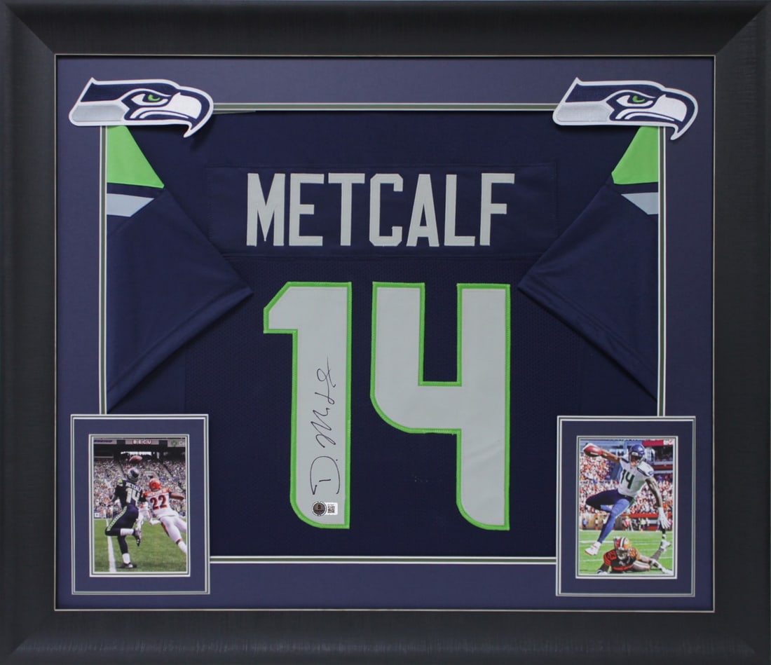 Framed Navy Jersey Signed by D.K. Metcalf with Beckett Authentication: Framed Navy Jersey Signed by D.K. Metcalf with Beckett Authentication This professionally framed navy blue pro style jersey is personally signed by D.K. Metcalf of the Seattle Seahawks. The autograph 