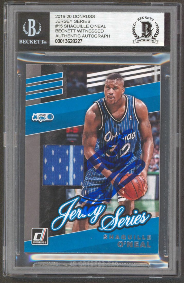 Shaquille O'Neal Autographed Donruss Jersey Series Card Beckett Authenticated Slab: Shaquille O'Neal Autographed Donruss Jersey Series Card Beckett Authenticated Slab This 2019 Donruss Jersey Series #15 basketball card features the Orlando Magic and is personally signed by Shaquille 