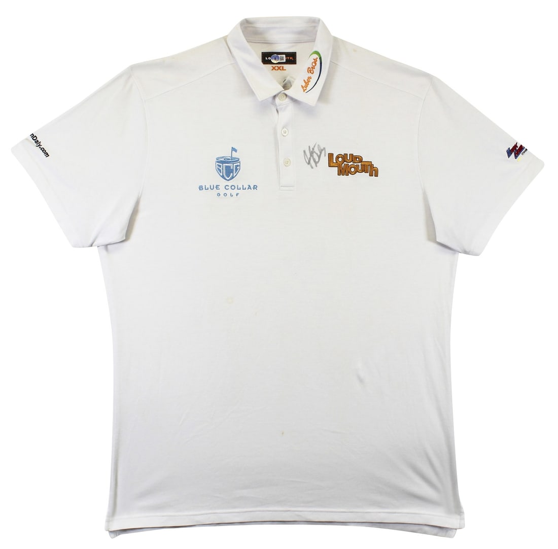 John Daly Signed Match Worn White Loudmouth Polo Shirt BAS Authentic: John Daly Signed Match Worn White Loudmouth Polo Shirt BAS Authentic This authentic match worn white Loudmouth polo shirt, featuring the Mark Christopher BCG Luber Bros design, has been personally sig