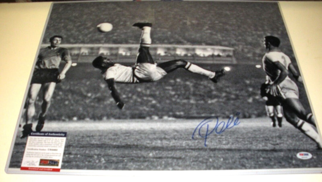 Signed 16x20 Photo of Pele Bicycle Kick with PSA/DNA Authentication: Signed 16x20 Photo of Pele Bicycle Kick with PSA/DNA Authentication This 16x20 photo features Brazilian soccer star Pele performing his iconic bicycle kick. The photograph is signed and comes with PSA