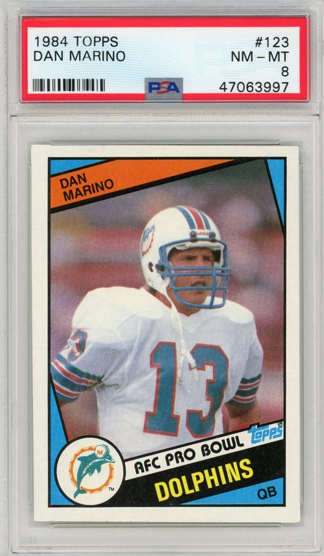 1984 Topps #123 Dan Marino Rookie Football Card PSA 8: 1984 Topps #123 Dan Marino Rookie Football Card PSA 8 Original 1984 Topps Dan Marino #123 rookie football card, professionally graded PSA 8 NM-MT and encapsulated by Professional Sports Authenticator.