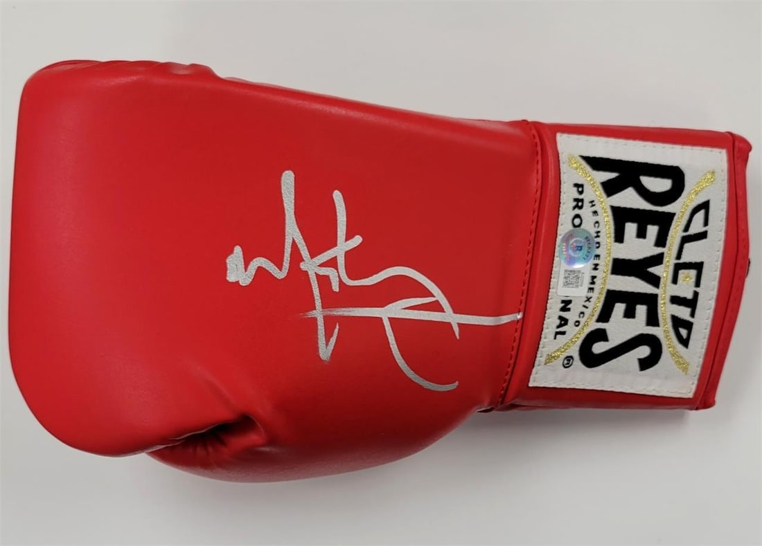 Boxing Glove Autographed by Mark Wahlberg from The Fighter Beckett Authenticated: Boxing Glove Autographed by Mark Wahlberg from The Fighter Beckett Authenticated This original boxing glove is signed by Mark Wahlberg in silver ink and is associated with the movie 'The Fighter.' The