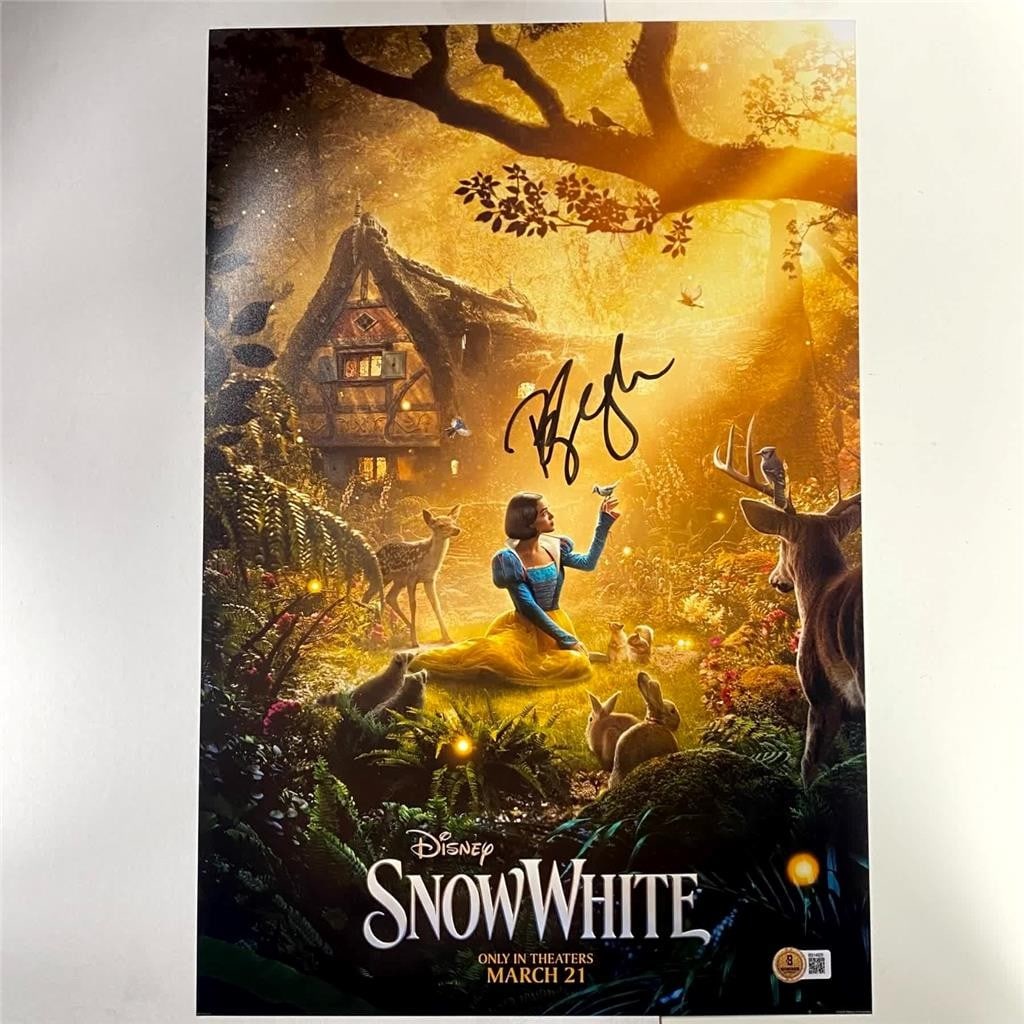 12x18 Photograph Signed by Rachel Zegler Beckett Authenticated: 12x18 Photograph Signed by Rachel Zegler Beckett Authenticated This original 12x18 poster photograph features a genuine autograph from Rachel Zegler, known for her role in Snow White. Authenticated by