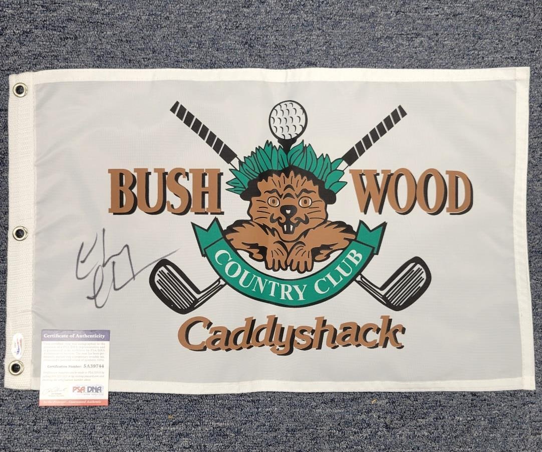 Chevy Chase Autographed Caddyshack Bushwood Pin Flag PSA ITP: Chevy Chase Autographed Caddyshack Bushwood Pin Flag PSA ITP This is an original pin flag from the iconic movie 'Caddyshack', featuring the autograph of Chevy Chase, who portrayed the beloved characte