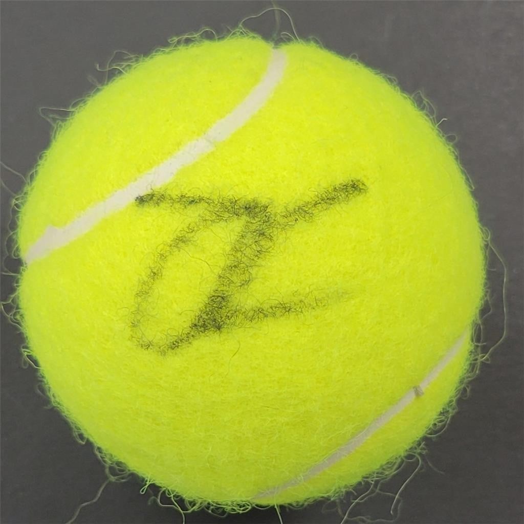 Emma Raducanu Signed Tennis Ball Wimbledon Champion JSA Authenticated: Emma Raducanu Signed Tennis Ball Wimbledon Champion JSA Authenticated This is an original tennis ball signed by Emma Raducanu, the Wimbledon Champion. The autograph has been authenticated by James Spe