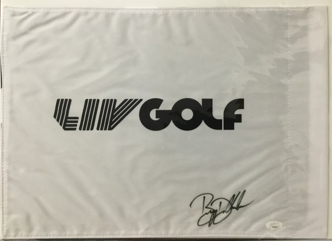 Bryson DeChambeau Signed LIV Golf Flag JSA Authenticated: Bryson DeChambeau Signed LIV Golf Flag JSA Authenticated This official LIV Golf pin flag features the authentic signature of PGA and LIV star Bryson DeChambeau. The autograph has been verified by Jame