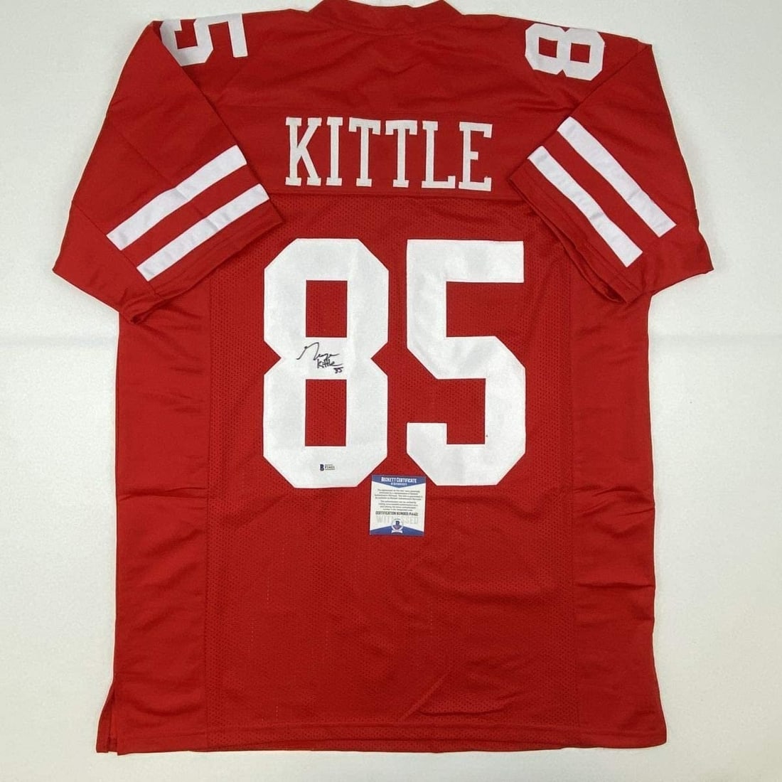 George Kittle Signed Custom Football Jersey Red Beckett COA XL: George Kittle Signed Custom Football Jersey Red Beckett COA XL Pre-owned custom red football jersey signed by George Kittle. This original autographed collectible comes with Beckett authentication. Th