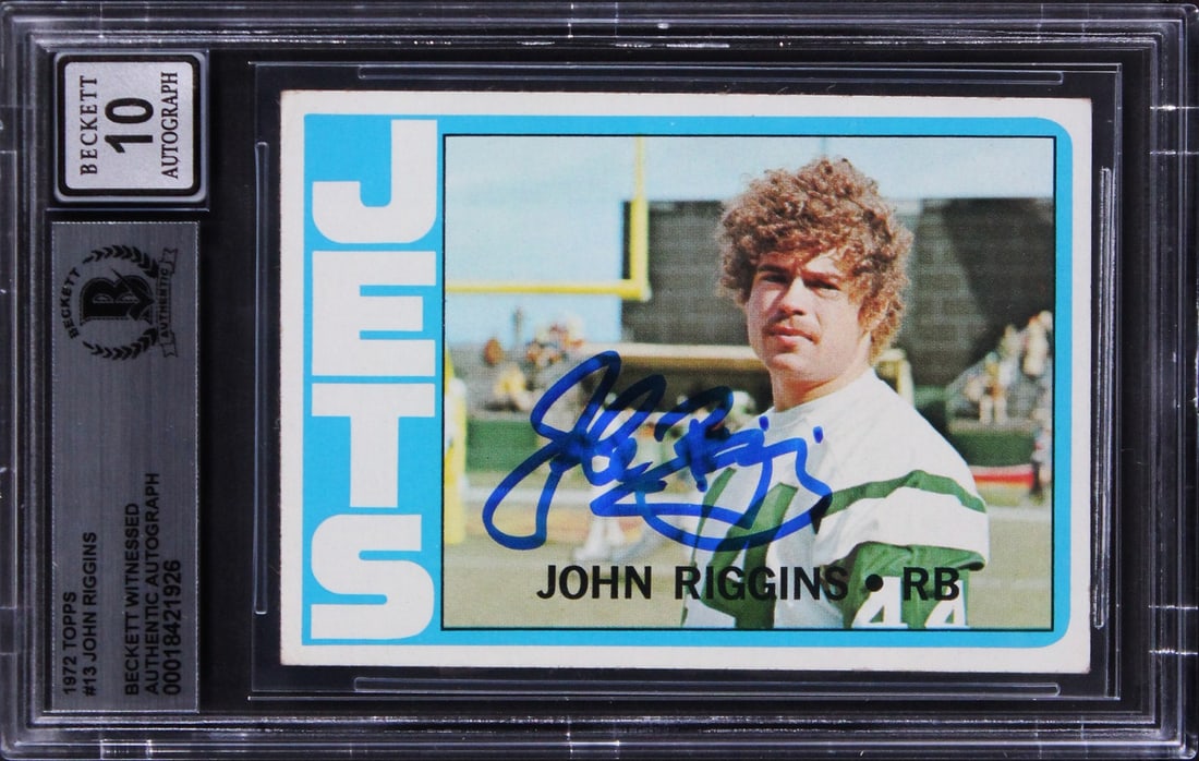 John Riggins Signed 1972 Topps Rookie Card Gem Mint 10 BAS Slabbed: John Riggins Signed 1972 Topps Rookie Card Gem Mint 10 BAS Slabbed This remarkable 1972 Topps #13 Rookie Card features the autograph of John Riggins, a legendary player for the New York Jets. Graded G
