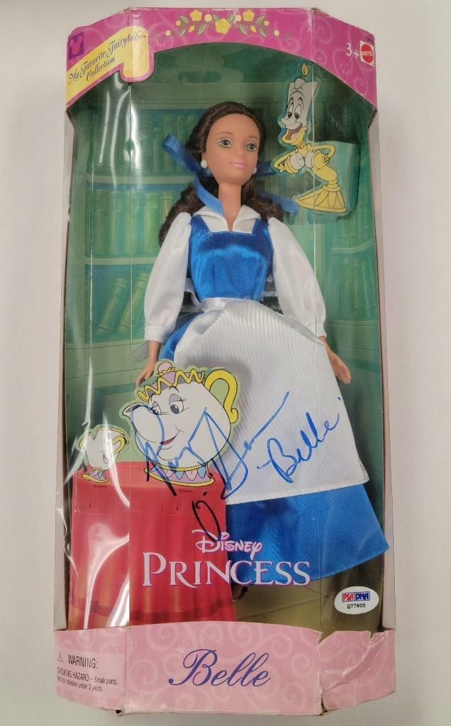 Beauty and the Beast Doll Signed by Paige O'Hara PSA Authenticated: Beauty and the Beast Doll Signed by Paige O'Hara PSA Authenticated This Beauty and the Beast figure doll is signed by Paige O'Hara, the voice of Belle. The autograph is authenticated by PSA/DNA. The i