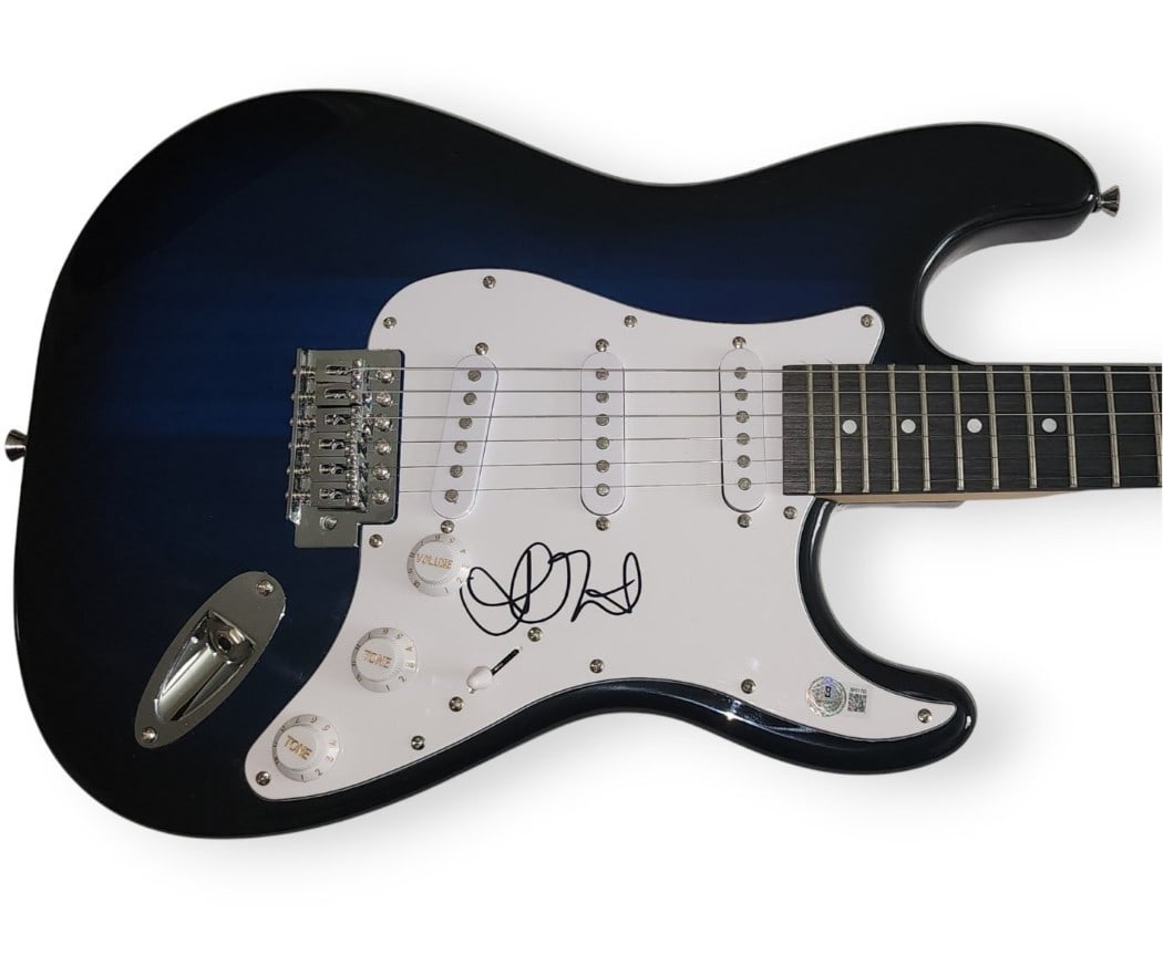 Alanis Morissette Signed Electric Guitar Jagged Little Pill Beckett Authenticated: Alanis Morissette Signed Electric Guitar Jagged Little Pill Beckett Authenticated This is a hand-signed electric guitar by Alanis Morissette, featuring her autograph on the body. It comes with Beckett