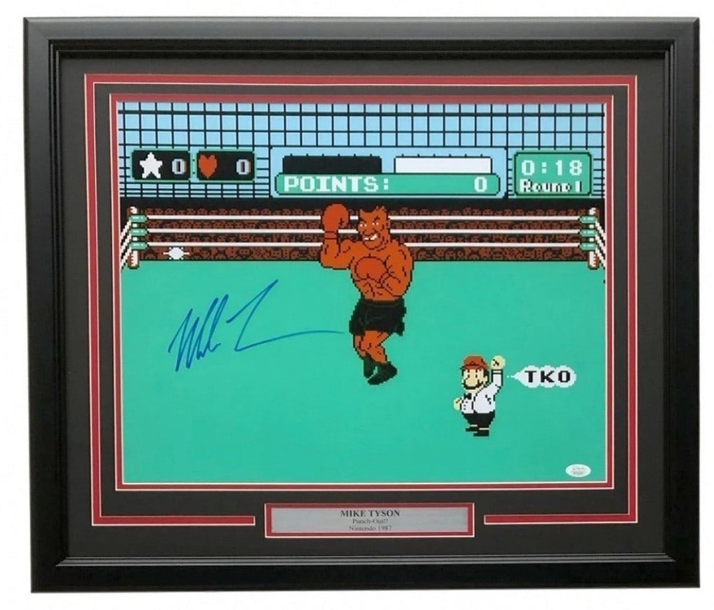 Framed 20x16 Mike Tyson Signed Punch Out Photo JSA: Framed 20x16 Mike Tyson Signed Punch Out Photo JSA Framed "Punch Out" photo featuring Mike Tyson, hand-signed and authenticated by James Spence Authentication (JSA). This original boxing collectible i