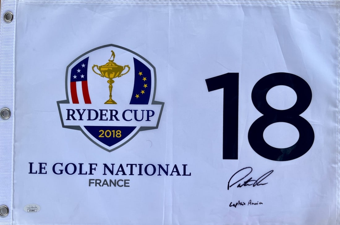 Patrick Reed Signed 2018 Ryder Cup Flag with Captain America Inscription JSA: Patrick Reed Signed 2018 Ryder Cup Flag with Captain America Inscription JSA This authentic 2018 Ryder Cup Le Golf National pin flag, signed by Patrick Reed, is a must-have for golf enthusiasts. The f
