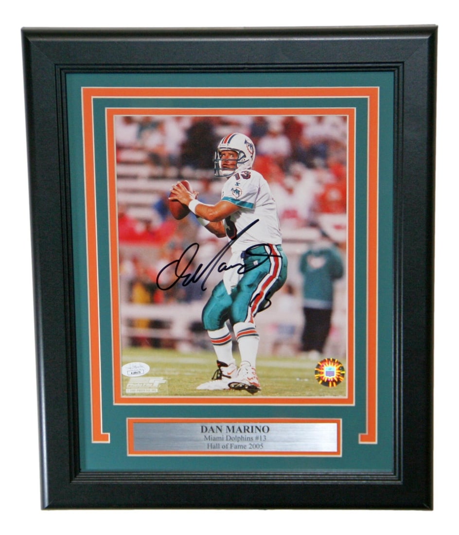 Dan Marino Autographed 8x10 Photo Miami Dolphins JSA Certified: Dan Marino Autographed 8x10 Photo Miami Dolphins JSA Certified This is a remarkable framed 8x10 photo of NFL legend Dan Marino, showcasing his iconic legacy with the Miami Dolphins. The photo is autog