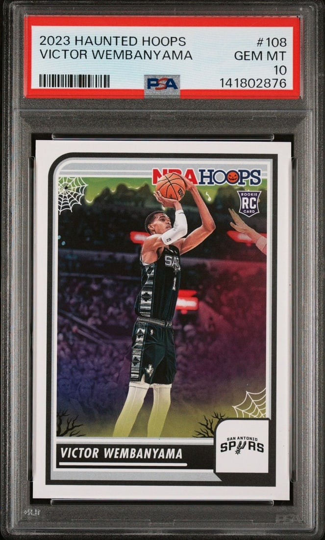PSA 10 Victor Wembanyama 2023 Panini Haunted Hoops Rookie Card 108: PSA 10 Victor Wembanyama 2023 Panini Haunted Hoops Rookie Card 108 Graded 2023 Panini Haunted Hoops Victor Wembanyama #108 rookie sports trading card, encapsulated and graded PSA 10. This pre-owned ca