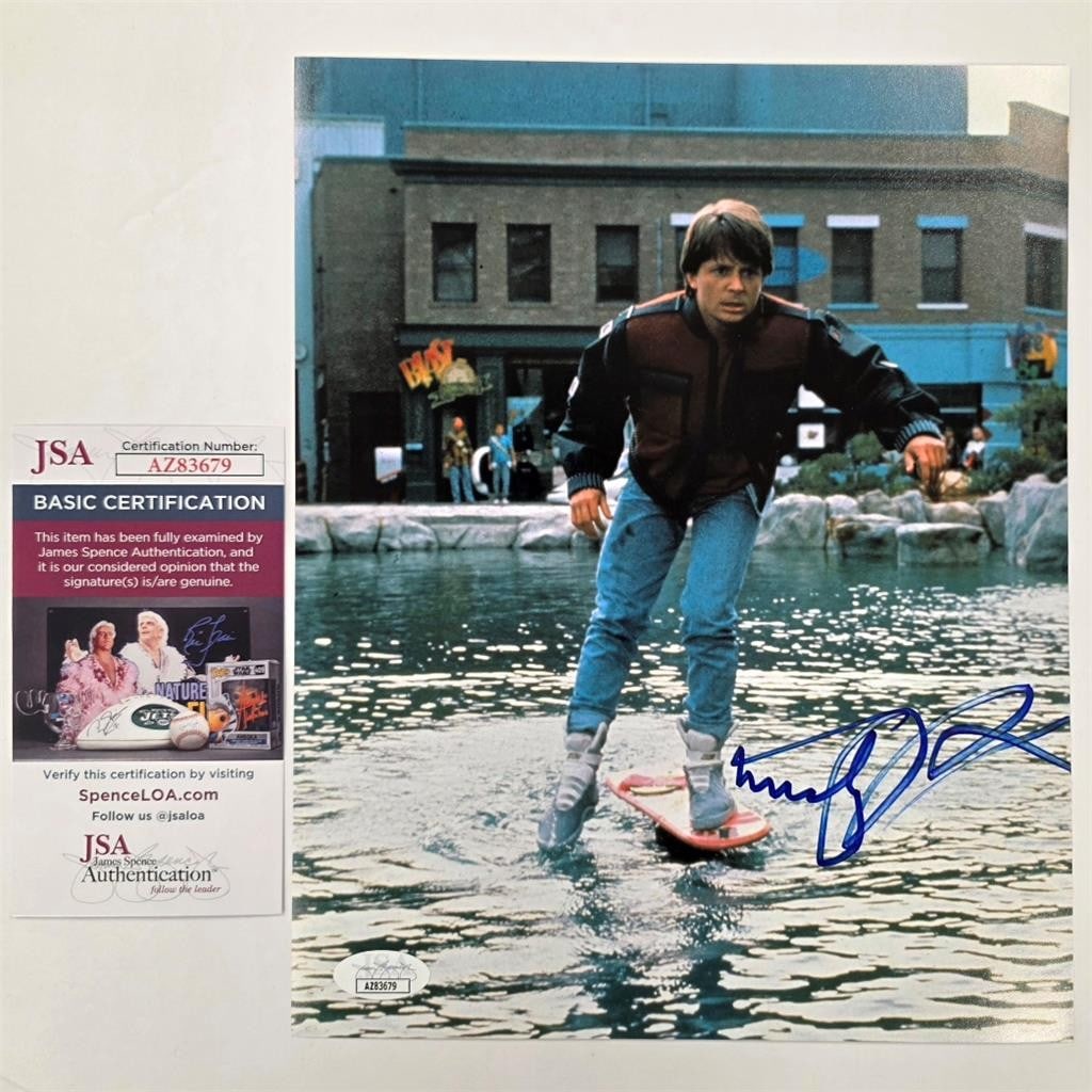 8x10 Back to the Future Photo Signed by Michael J. Fox JSA Authenticated: 8x10 Back to the Future Photo Signed by Michael J. Fox JSA Authenticated This is an original 8x10 photograph featuring the Back to the Future hover board, signed by Michael J. Fox. The autograph has b