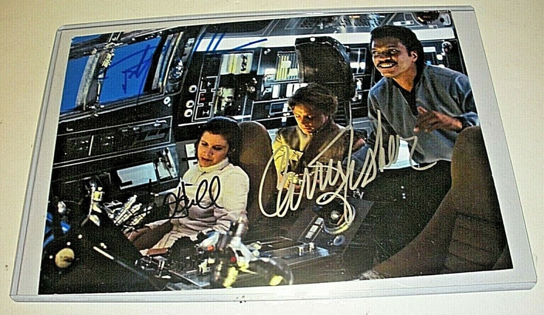 Star Wars Signed Photo with COA Carrie Fisher Mark Hamill Billy Dee Williams: Star Wars Signed Photo with COA Carrie Fisher Mark Hamill Billy Dee Williams This pre-owned Star Wars photo is signed by Carrie Fisher, Mark Hamill, and Billy Dee Williams. The item originates from th
