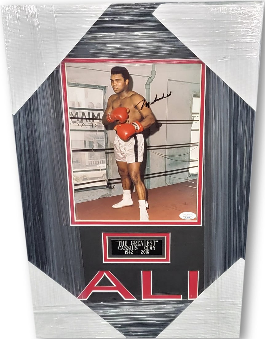Muhammad Ali Autographed Photo Custom Framed 13 x 20 JSA Authenticated: Muhammad Ali Autographed Photo Custom Framed 13 x 20 JSA Authenticated This stunning custom-framed photo features the legendary Muhammad Ali, hand-signed by the boxing icon himself. The photograph is 
