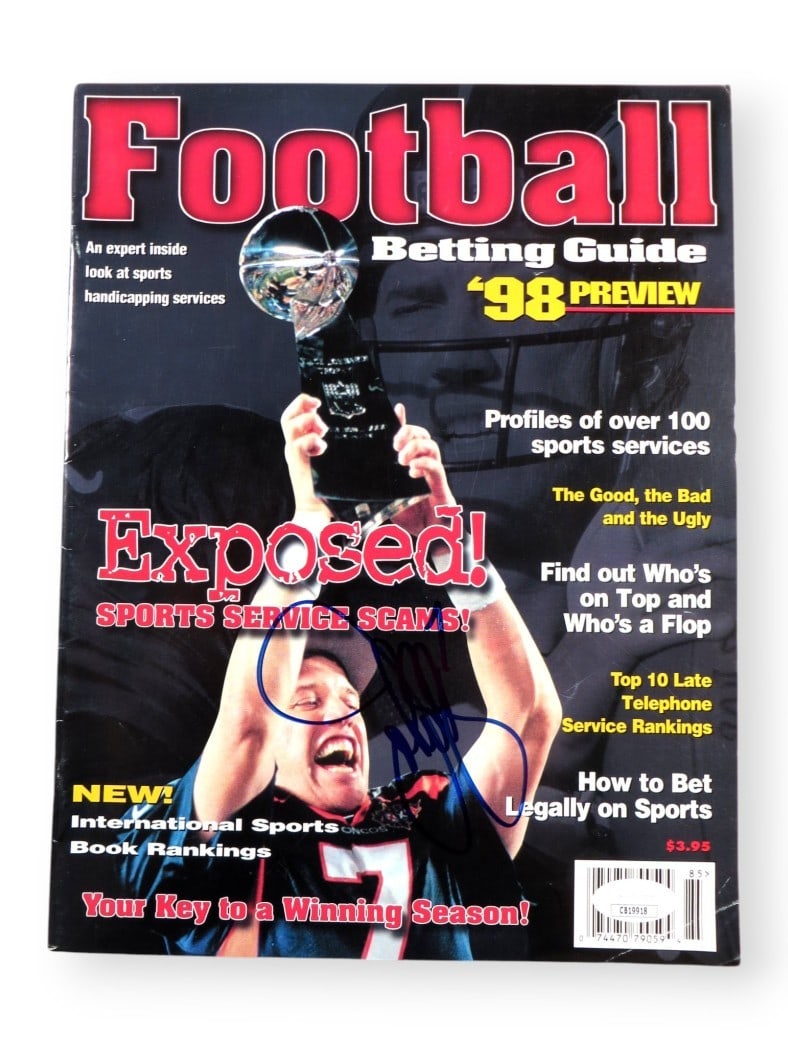 John Elway Autographed 1998 Football Betting Guide Magazine JSA Certified: John Elway Autographed 1998 Football Betting Guide Magazine JSA Certified This is an original magazine featuring John Elway, the legendary quarterback of the Denver Broncos. The magazine is a 1998