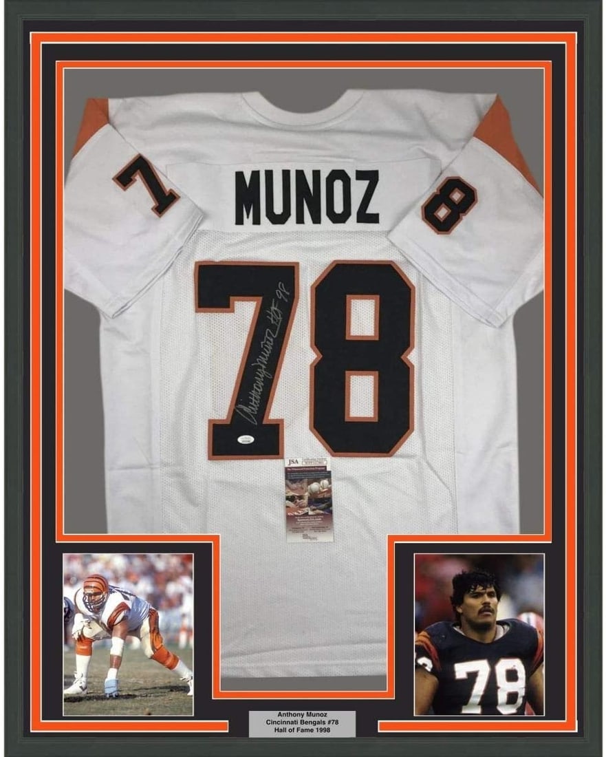 Anthony Munoz autographed framed Bengals white jersey JSA 35x39: Anthony Munoz autographed framed Bengals white jersey JSA 35x39 Professionally framed and matted signed Anthony Munoz white Cincinnati Bengals jersey. This original autographed display includes two 5x