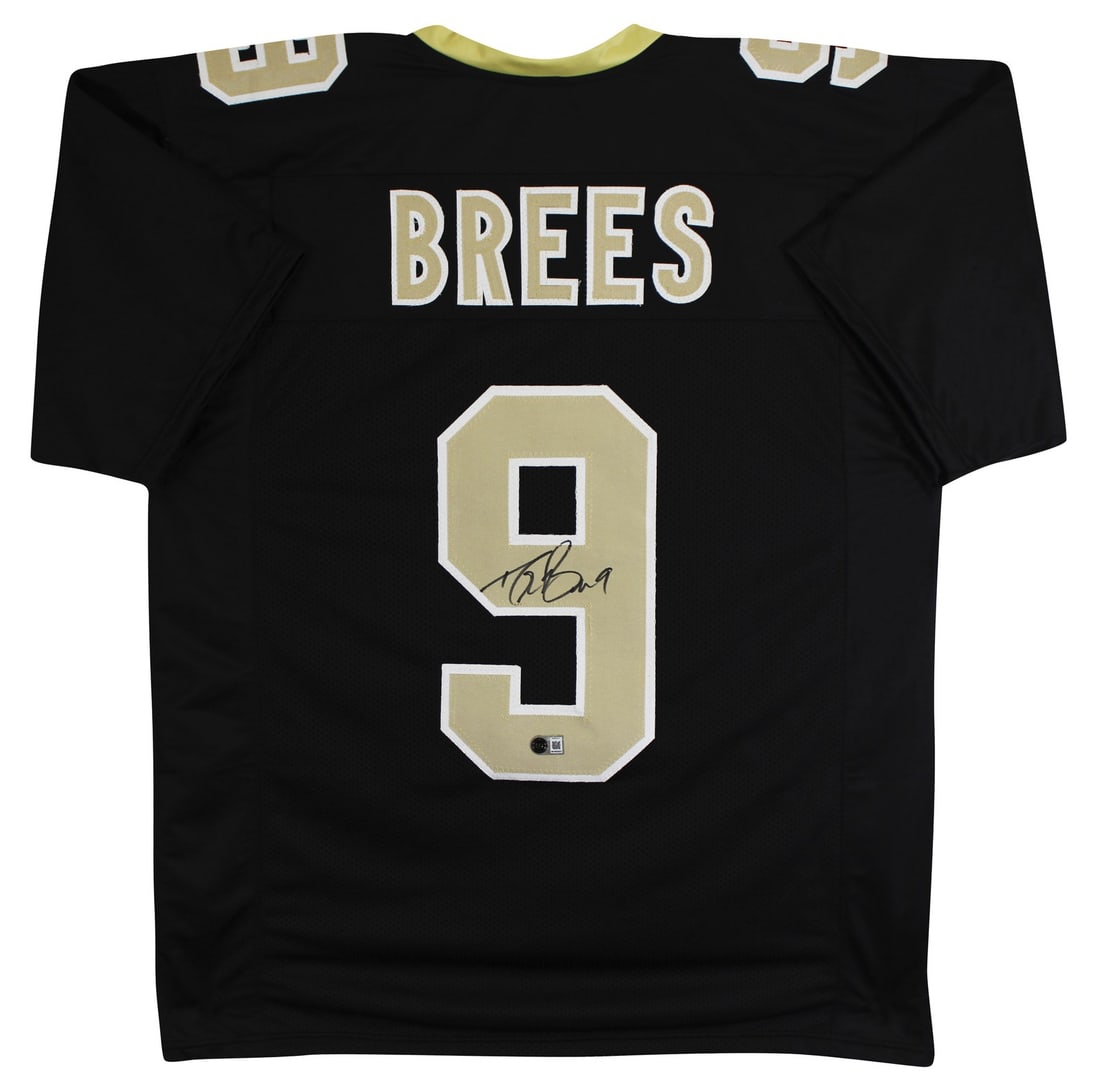 Drew Brees signed black football jersey Beckett BAS witnessed: Drew Brees signed black football jersey Beckett BAS witnessed Authentic black pro style jersey personally signed by Drew Brees. This pre-owned, custom-stitched jersey is a non-branded X-Large example 