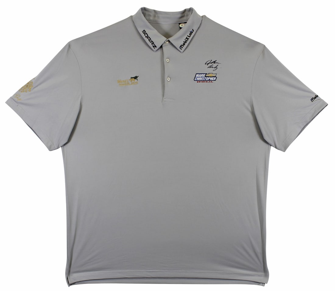 John Daly Signed Match Worn Grey Polo Shirt BAS Authenticated: John Daly Signed Match Worn Grey Polo Shirt BAS Authenticated This authentic match-worn grey polo shirt, personally signed by golf legend John Daly, is a remarkable piece for any golf enthusiast. The 