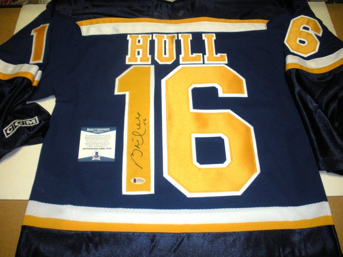 Brett Hull Signed St. Louis Blues Jersey with Beckett COA: Brett Hull Signed St. Louis Blues Jersey with Beckett COA This is an officially licensed CCM jersey signed by Brett Hull, the legendary player from the St. Louis Blues and a Hall of Famer. The jersey 