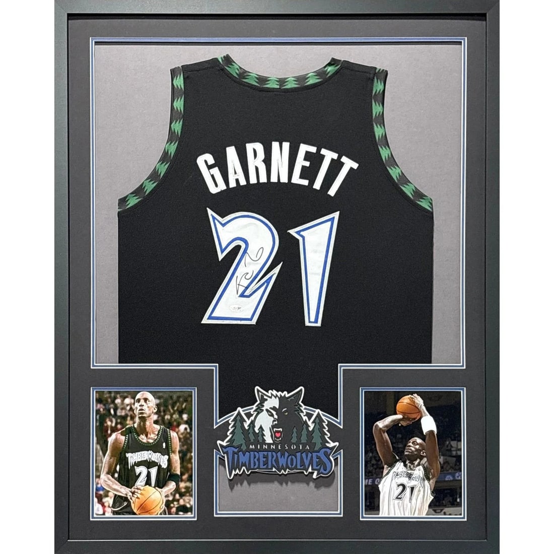 Framed Kevin Garnett Autographed Timberwolves Jersey JSA Certified: Framed Kevin Garnett Autographed Timberwolves Jersey JSA Certified Framed black Timberwolves jersey signed by Kevin Garnett. This autographed piece is JSA authenticated and includes a tamper-proof sti