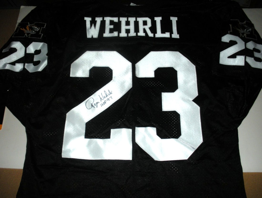 Roger Wehrli Signed Missouri Tigers Wilson Jersey with COA: Roger Wehrli Signed Missouri Tigers Wilson Jersey with COA This officially licensed Wilson jersey features the autograph of Roger Wehrli, a standout player for the Missouri Tigers. An excellent collec