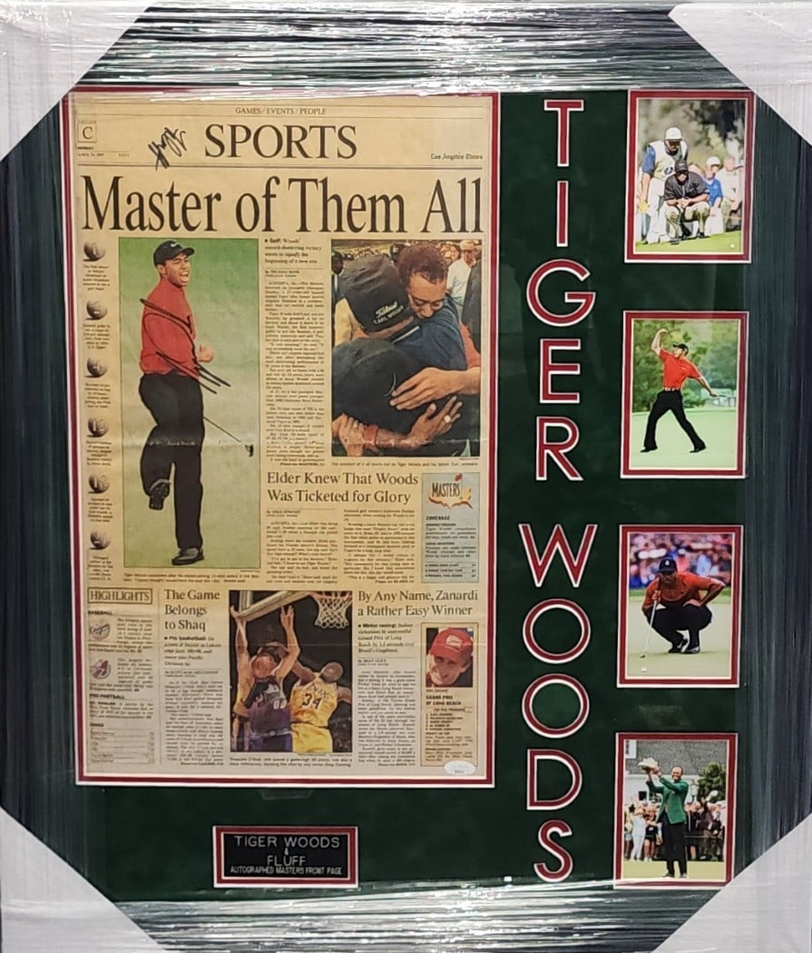 Framed Newspaper Featuring Tiger Woods Signature Authenticated by JSA: Framed Newspaper Featuring Tiger Woods Signature Authenticated by JSA This framed newspaper features an original autograph by Tiger Woods, commemorating his achievements as Master of the All. The piec