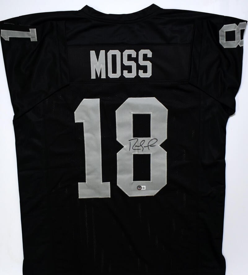 Black Pro Style Jersey Signed by Randy Moss Beckett Hologram: Black Pro Style Jersey Signed by Randy Moss Beckett Hologram Autographed black pro style jersey featuring Randy Moss. This pre-owned piece includes a Beckett Witness hologram. Specifications Player: R