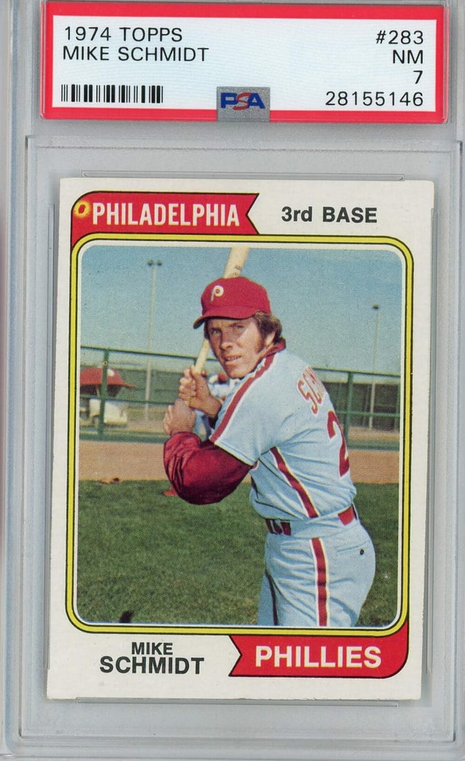 PSA 7 Mike Schmidt 1974 Topps #283 Phillies Baseball Card: PSA 7 Mike Schmidt 1974 Topps #283 Phillies Baseball Card Original 1974 Topps Mike Schmidt #283 second-year baseball card, professionally encapsulated and graded PSA 7 NM. This pre-owned MLB card