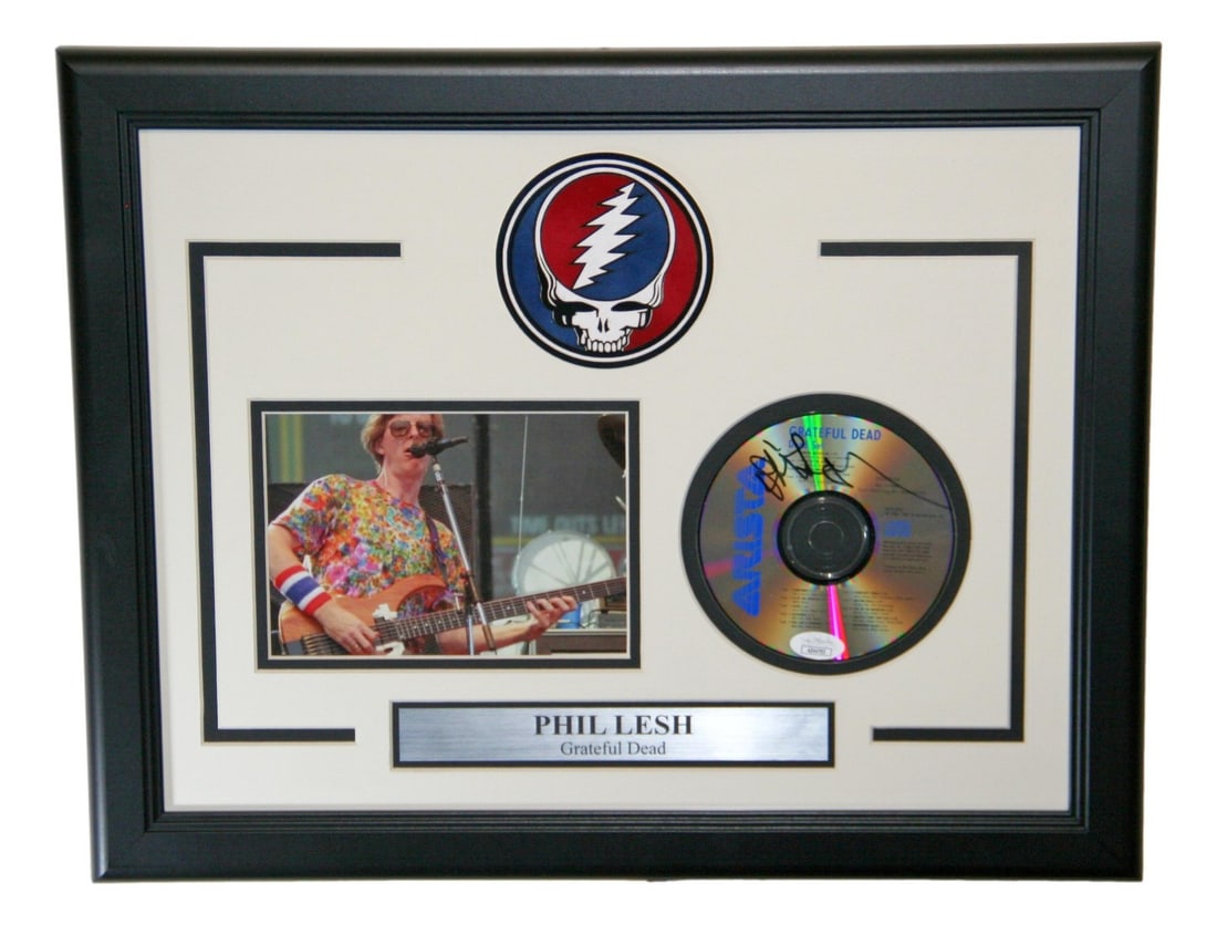 Framed Phil Lesh Signed CD and Booklet with Photo JSA Authenticated: Framed Phil Lesh Signed CD and Booklet with Photo JSA Authenticated Framed original CD and booklet display autographed by Phil Lesh, featuring a photo and authenticated by James Spence (JSA). This