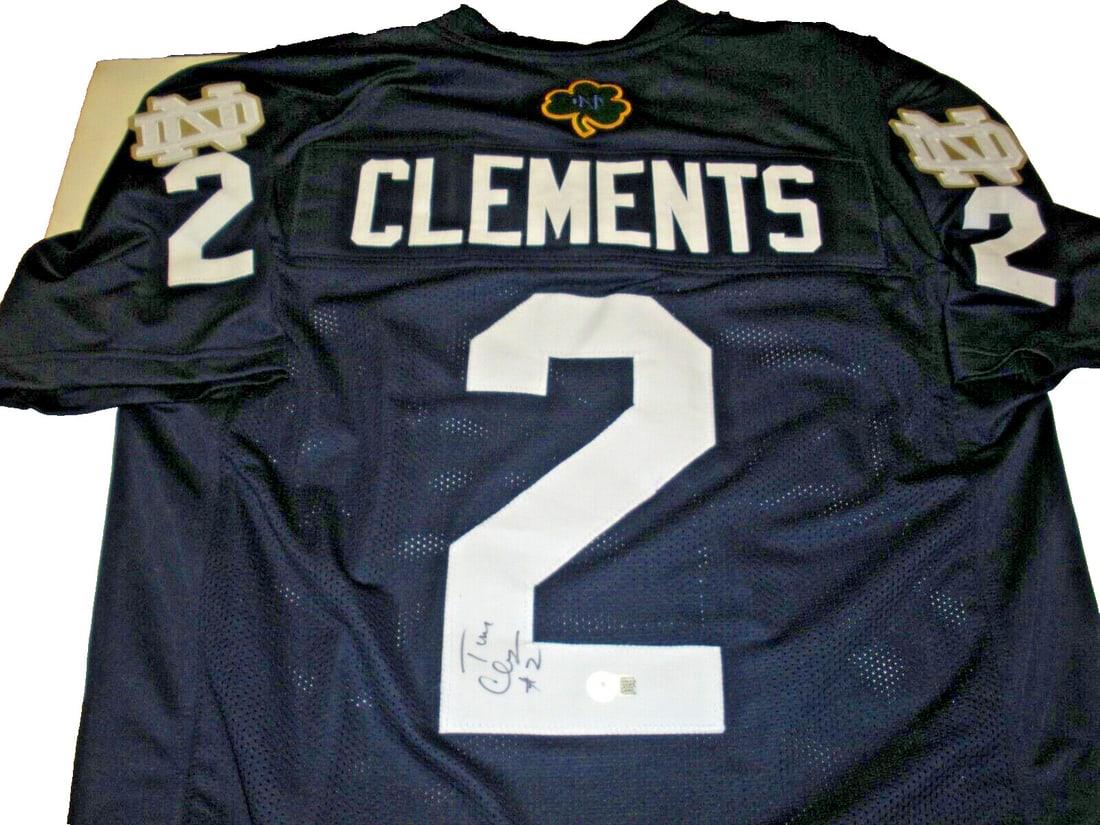 Tom Clements Autographed Notre Dame Jersey with Beckett COA: Tom Clements Autographed Notre Dame Jersey with Beckett COA This is a pre-owned Notre Dame Fighting Irish jersey signed by Tom Clements. The jersey comes with a Beckett Certificate of Authenticity, co